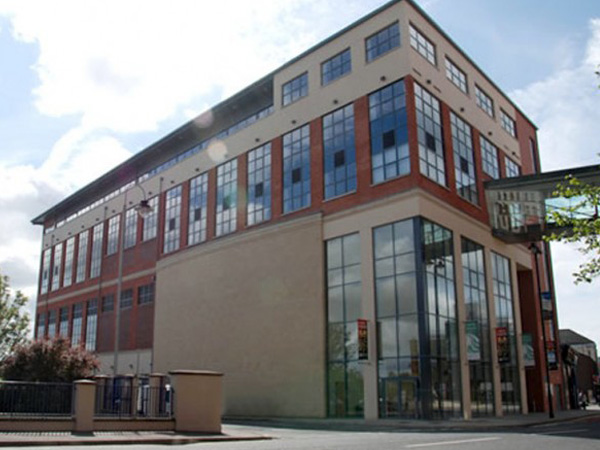 College building with red brick and glazed curtain walling