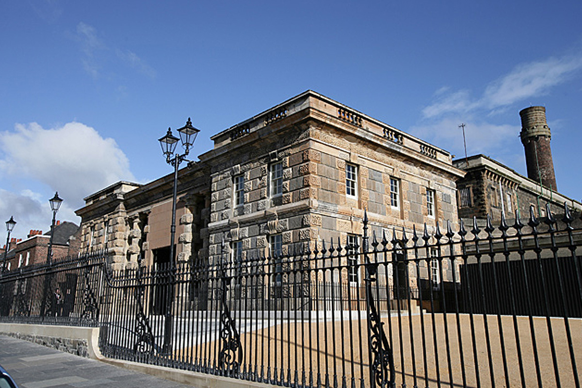 Crumlin Road Gaol behind its ornate railings