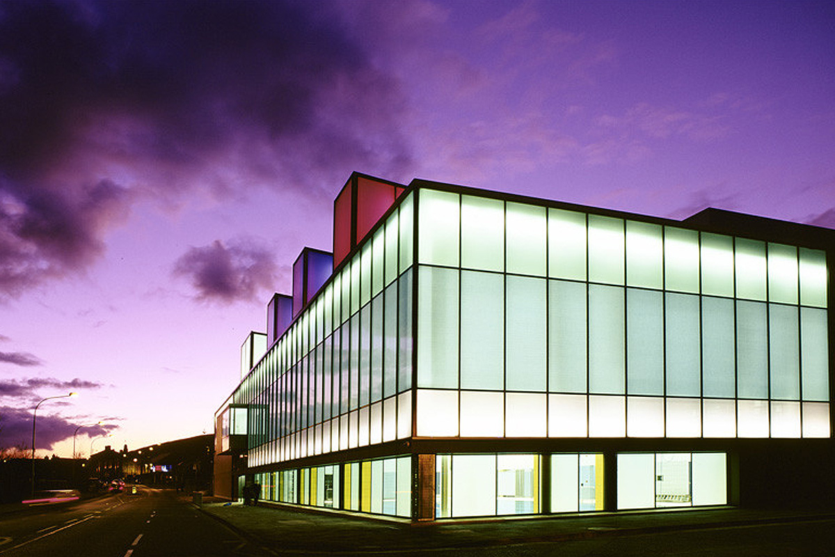 Falls Leisure Centre glowing at dusk